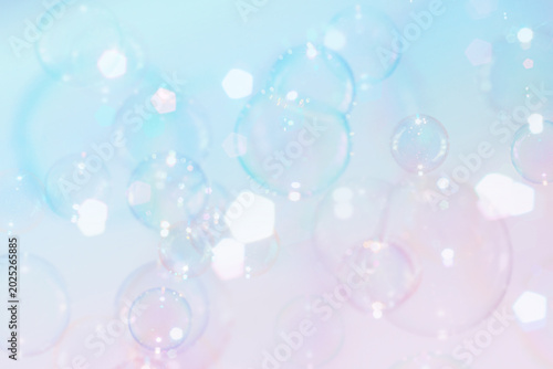 Beautiful Clear Colorful Soap Bubbles Floating in The Air. Celebration Festive Backdrop. Freshness Soap Suds Bubbles Water. Blue and White Gradient Textured. 