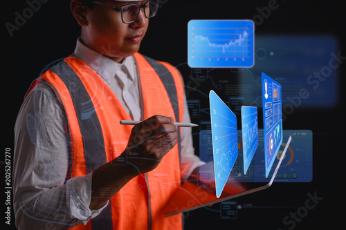 DevOps engineer in Digital transformation technology strategy of business processes and data, optimize automate operations, customer service management, engineer man using tablet and chart diagram