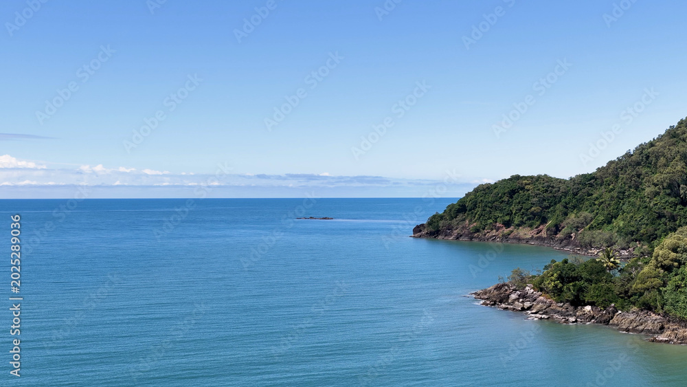 Obraz premium Aerial View of Lush Daintree Rainforest Headland Meeting the Coral Sea