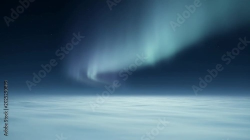 The video captures a breathtaking scene of the night sky illuminated by vibrant auroras, displaying shades of green and blue dancing across the darkness