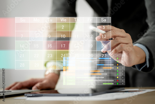 Fotografia Businessman manages time for effective work