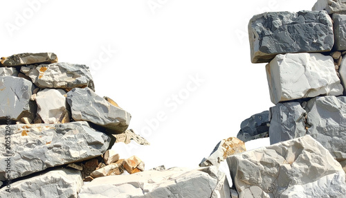 Close-up of a decaying stone wall with a gaping hole. Constructed from gray and white rocks with a black void