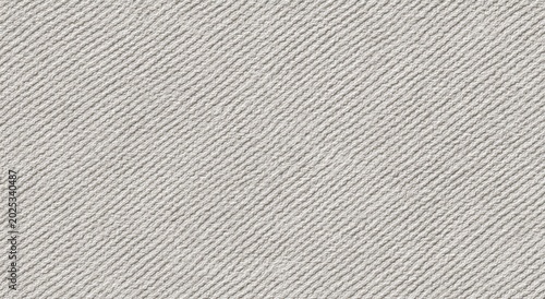 Close-up, textured weave of light brown fabric with diagonal ribbing