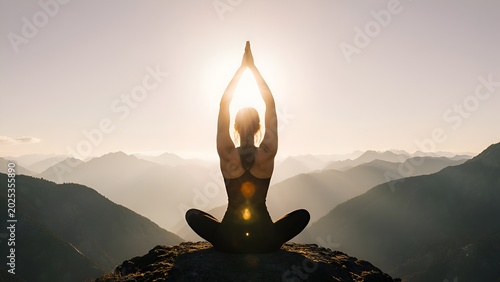 Back view of woman practicing yoga on mountain peak at breathtaking sunrise, International Yoga Day poster