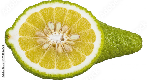 A cross-section of a fresh bergamot citrus fruit showing yellow pulp, white pith, and seeds against a solid black background