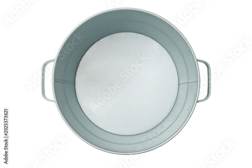Empty round metal basin with handle on transparent background. Galvanized steel tub viewed from above. Industrial container for cleaning, gardening or beverage icing, cleaning supply equipment.