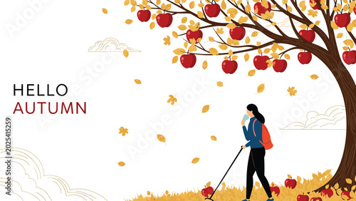 Woman hiking with a walking stick travels through a golden autumn field under a large apple tree with falling leaves and red fruit.