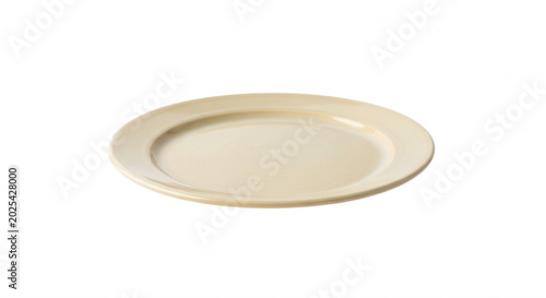A single, empty, cream-colored ceramic dinner plate viewed from a angle, isolated against a solid black background