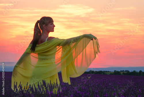 Canvas Print CLOSE UP: Carefree female tourist lets the breeze get caught in her light scarf