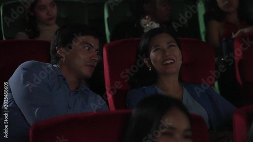 People go to watch movie at cinema complex during weekend. Lifestyle, weekend activity.