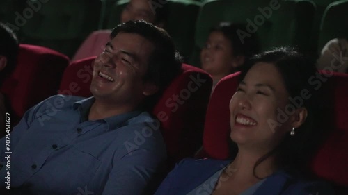 People go to watch movie at cinema complex during weekend. Lifestyle, weekend activity.