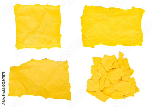 Set of torn yellow paper pieces and scraps isolated on white background