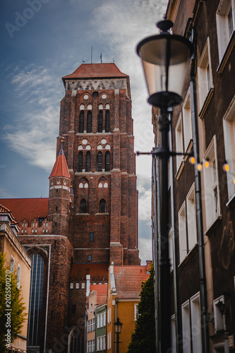 St. Mary’s Basilica Tower in Gdańsk Old Town Street View. Poland. 