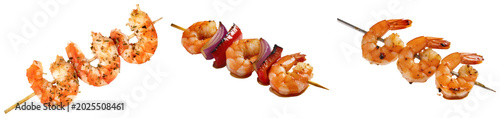 Tableau sur toile Three skewers of grilled shrimp, one with red onion and bell pepper, isolated on