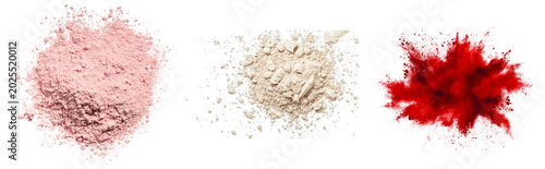 Obraz na płótnie Three piles of cosmetic powder: pink, beige, and red explosion, isolated on tran