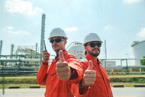 Tableau sur toile Oil and gas refinery in petroleum industry with inspection engineer, industrial