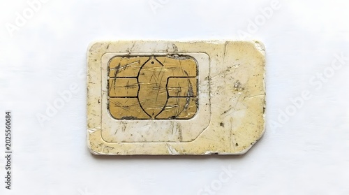 Close-Up White SIM Card with Gold Chip on Light Background