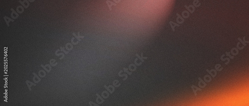Abstract gradient background with shades of gray and orange light effects