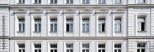 Classical white building facade with symmetrical windows rows