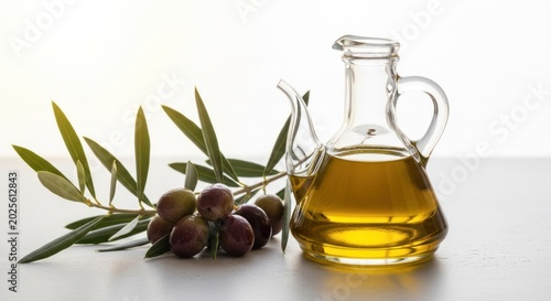 Ripe dark olives and carafe of extra virgin oil
