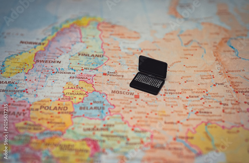 Canvas Print Miniature laptop on map of Russia.