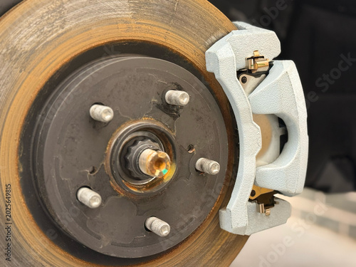 Photos Car ventilated front brake disc with caliper