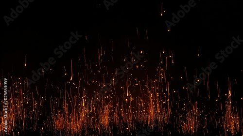 Photos Intense orange fire embers with glowing sparks and burning dust on a deep black background