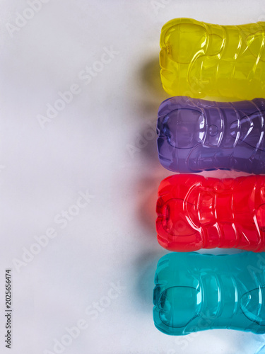 Multi-colored plastic bottles with multi-colored liquid, plastic, recycling