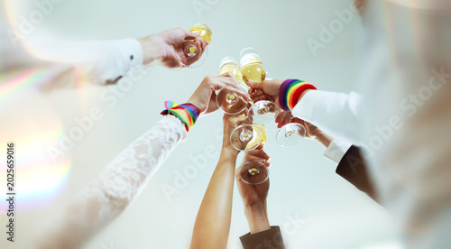 Friendship gathering for the LGBTQ community, a champagne party celebrating LGBTQ Pride expressing joy at being accepted in a society of pride : Concept LGBTQ Pride Month.