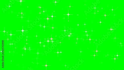Sparkling white stars of various sizes twinkle against a vibrant green screen background, creating a dynamic visual effect.