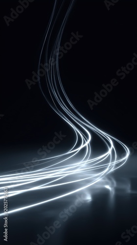 Abstract light trails on a dark background creating dynamic curves and patterns, showcasing the movement and flow of illuminated lines in a minimalist setting