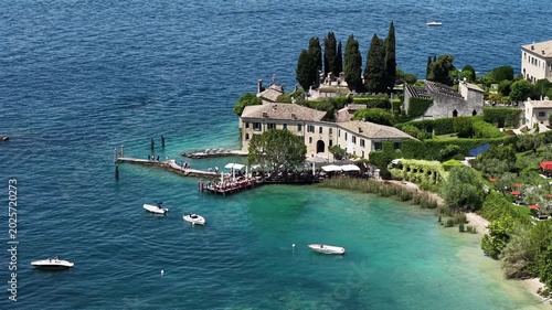 Scenic aerial panorama of Baia delle Sirene and the Bay of the Sirens on Lake Garda