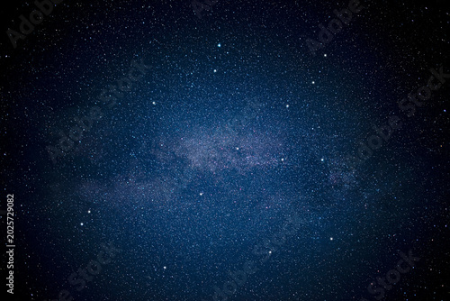 Tableau sur toile A beautiful night sky filled with countless glowing stars and the faint texture of the Milky Way galaxy