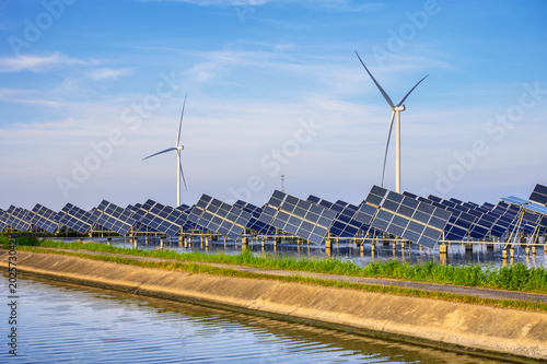 Coastal Floating Solar Farm with Wind Turbines at Golden Hour Sunset