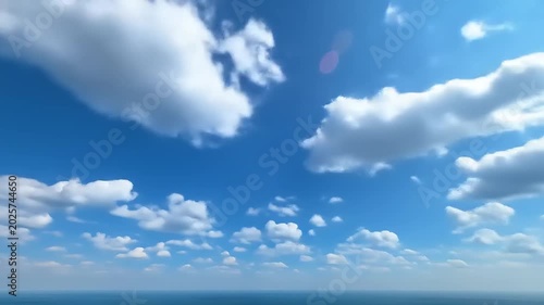 Clear blue sky with fluffy white clouds and sunlight abstract
