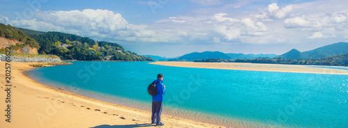 Photos A man walks on the beach. Man looks at the sea