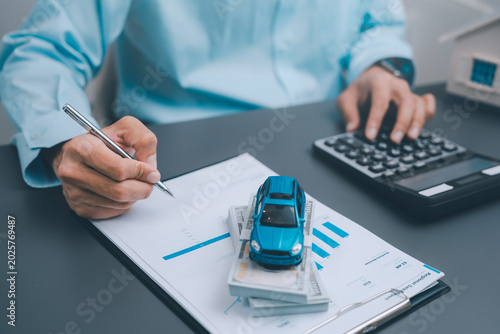 Fotografie Auto loan vehicle leasing and car insurance concept business person hand signing