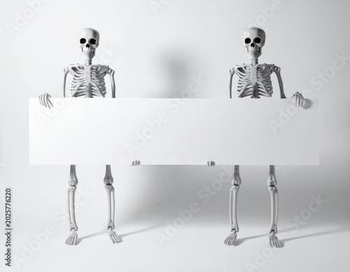 Two detailed skeletal models stand together, holding a long, horizontal blank white board ready for an important message or promotional text