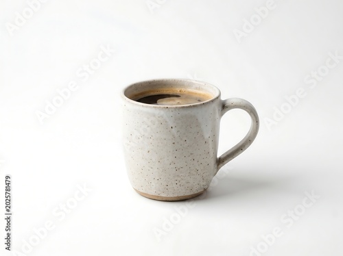 Ceramic coffee mug with speckles on white background
