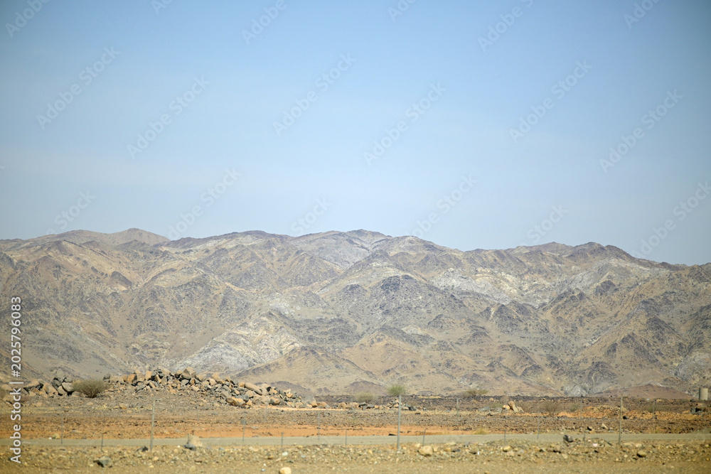 Fototapeta premium desert view with rocky mountains in the background in Mecca, Saudi Arabia