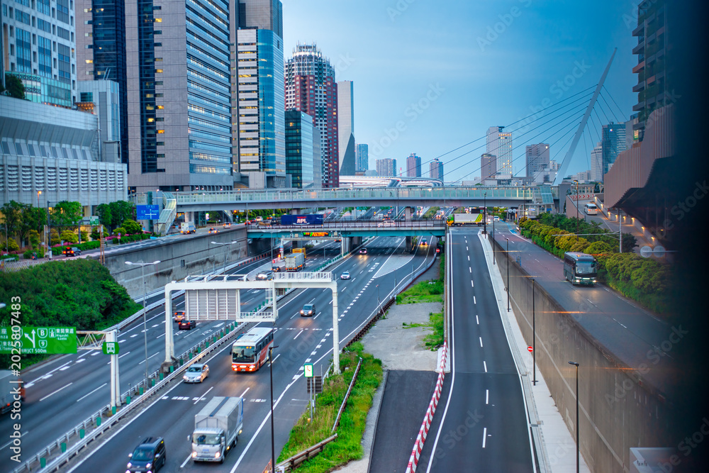 Fototapeta premium Urban scene of roads and traffic in Odaiba Tokyo, capturing bustling streets, vehicles, and modern cityscape