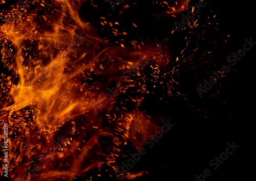 A black background with a lot of fire and smoke