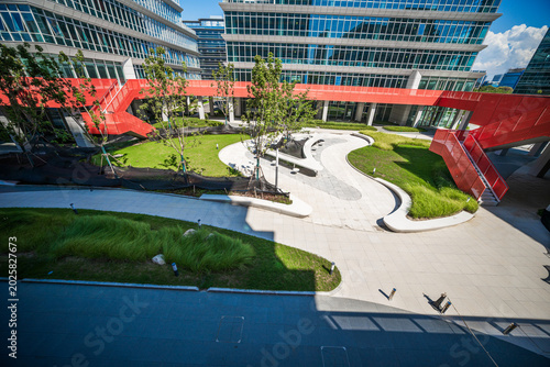 Modern Urban Landscape with Green Spaces and Sculptural Design Elements