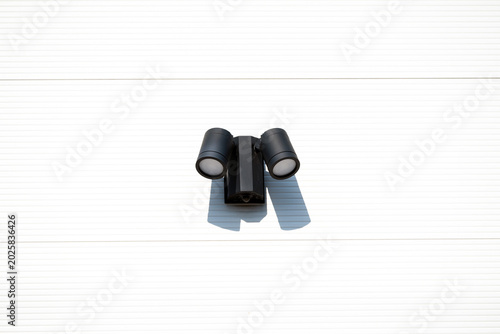 Outdoor LED Security Spotlight with Motion Sensor Mounted on Exterior Wall
