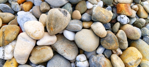 Bild auf Leinwand A mix of contrasting dark and light river stones
