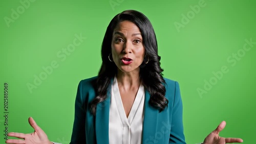 Woman Speaking and Gesturing in Front of a Green Screen