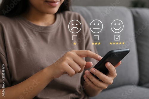Woman using a smartphone to rate or review a product through a feedback system.