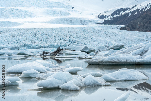 Glacier lagoon with icebergs floating at the foot of the Vatnajokull Glacier or Vatna Glacier, the largest and most voluminous ice cap in Iceland, and the second largest in area in Europe
