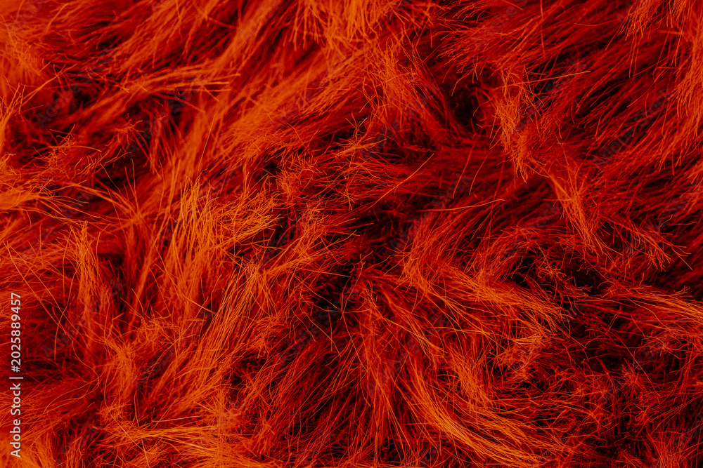 Obraz premium Warm vibrant deep red orange fluffy soft cozy textile material texture abstract surface background
