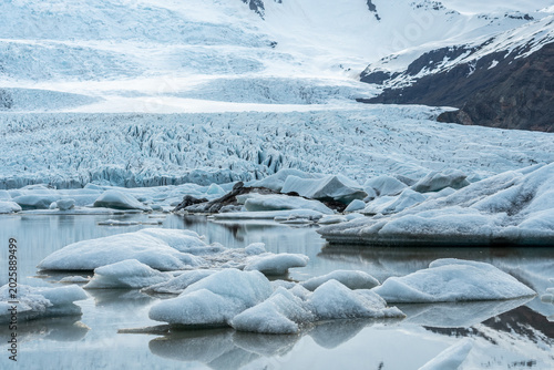 Glacier lagoon with icebergs floating at the foot of the Vatnajokull Glacier or Vatna Glacier, the largest and most voluminous ice cap in Iceland, and the second largest in area in Europe
